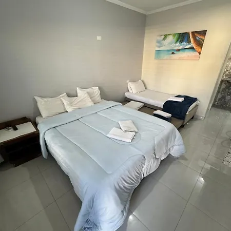 Suites Delphin Pe Na Areia Guarujá Quarto foto