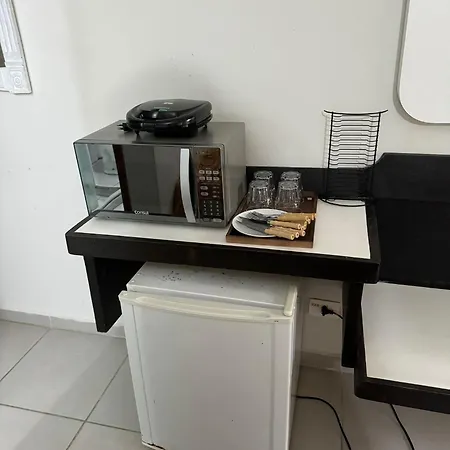 Suites Delphin Pe Na Areia Guarujá Quarto foto