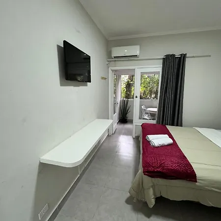 Suites Delphin Pe Na Areia Guarujá Quarto foto
