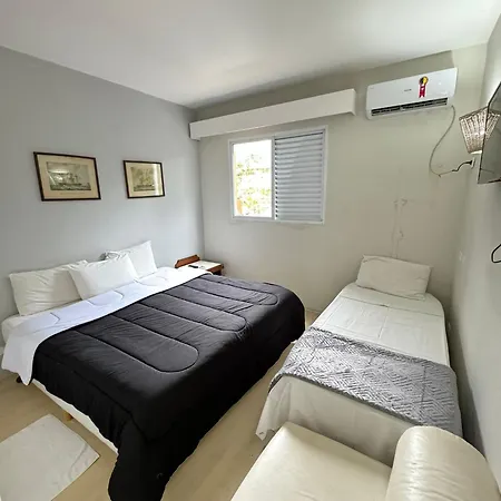 Suites Delphin Pe Na Areia Guarujá Quarto foto