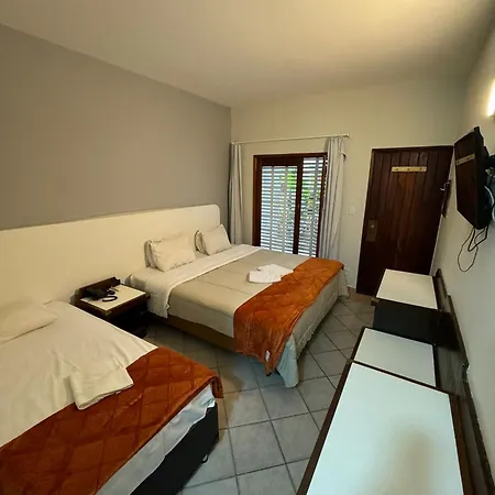 Suites Delphin Pe Na Areia Guarujá Quarto foto