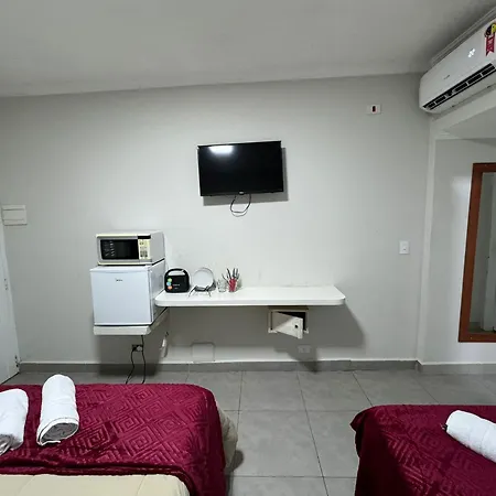Suites Delphin Pe Na Areia Guarujá Quarto foto