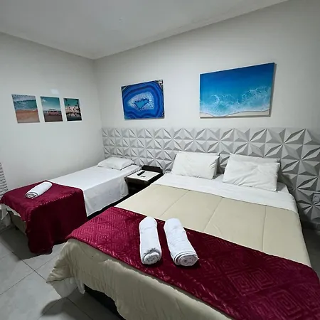 Suites Delphin Pe Na Areia Guarujá Quarto foto