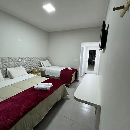 Suites Delphin Pe Na Areia Guarujá Quarto foto