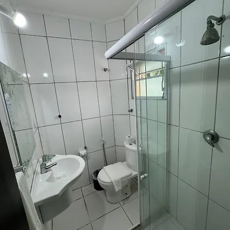 Suites Delphin Pe Na Areia Guarujá Quarto foto