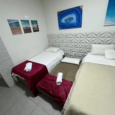 Suites Delphin Pe Na Areia Guarujá Quarto foto