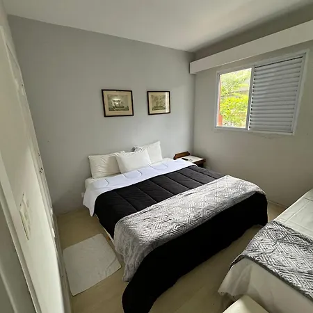 Suites Delphin Pe Na Areia Guarujá Quarto foto