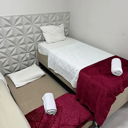 Suites Delphin Pe Na Areia Guarujá Quarto foto