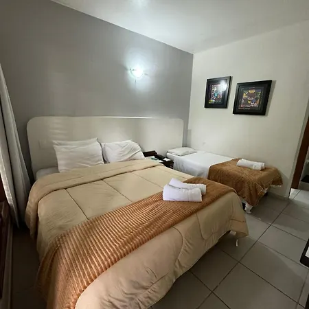 Suites Delphin Pe Na Areia Guarujá Quarto foto